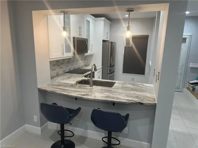 Kitchen with counter stools