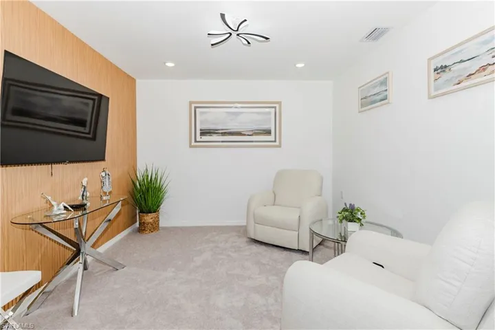 Sitting room featuring carpet flooring and recessed lighting