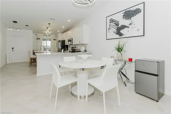 Dining area with baseboards and recessed lighting