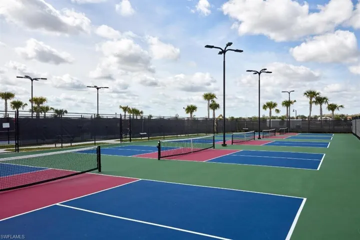 View of tennis court featuring community basketball court