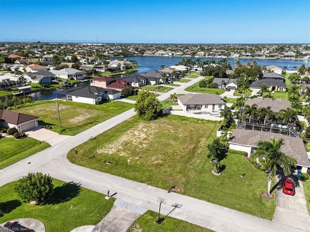 Aerial view of residential area with a large body of water