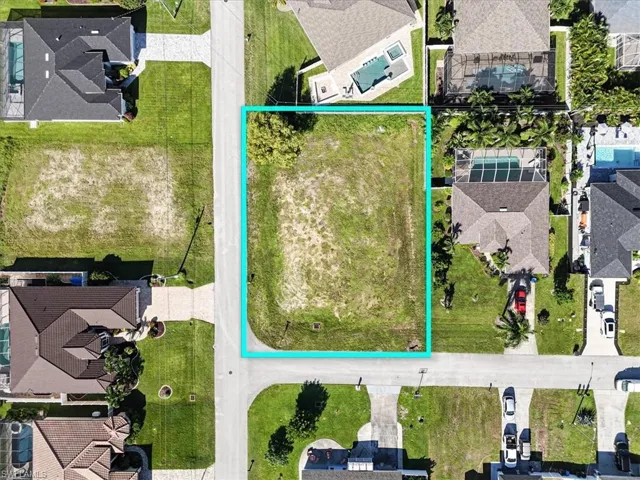 Aerial perspective of suburban area with property parcel outlined