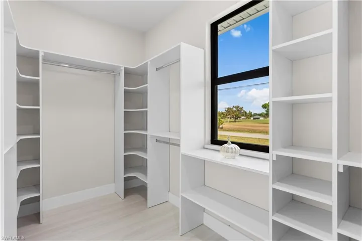 Primary Bedroom large close with custom made cabinetry