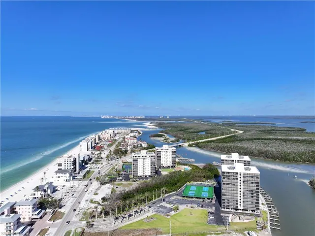 Birds eye view of property with a water view and a city view