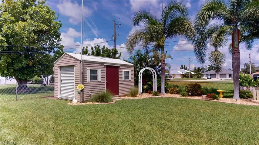 View of outbuilding featuring a yard