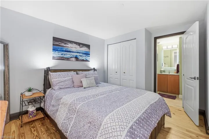 Guest Bedroom with a closet and light wood-style floors