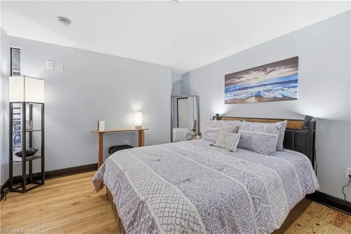 Guest Suite with light wood-type flooring