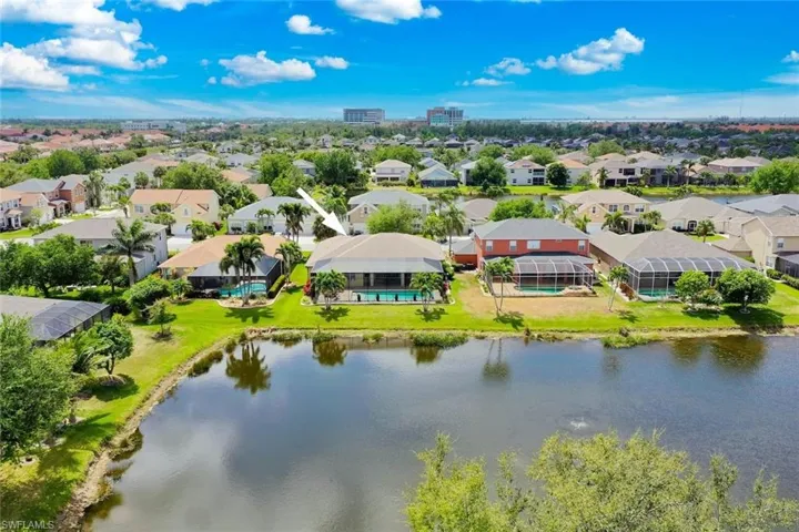 Birds eye view of property with a residential view and a water view