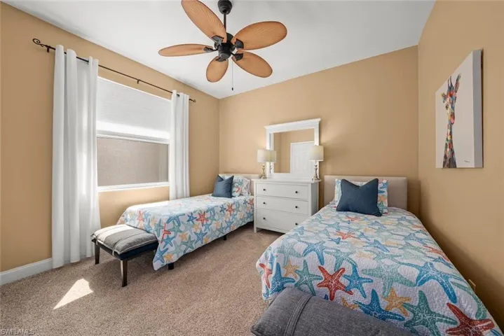 Bedroom featuring carpet flooring and a ceiling fan