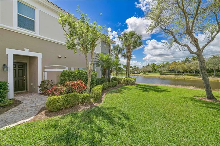 View of grassy yard featuring a water view