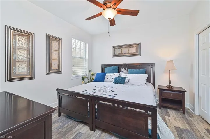 Bedroom with wood finished floors and ceiling fan