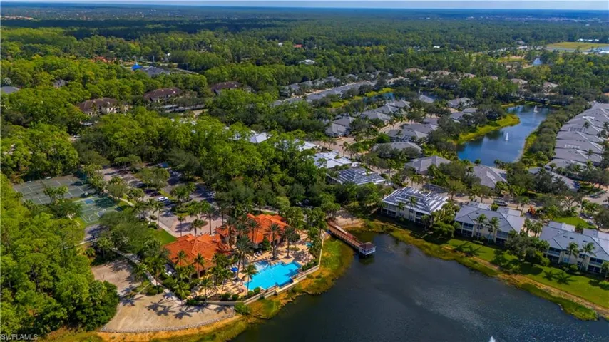 Aerial overview of property's location with a large body of water and nearby suburban area