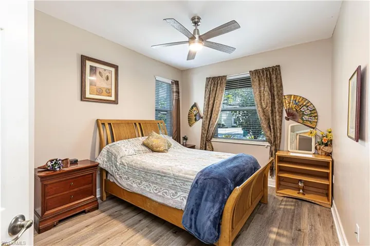 Bedroom featuring wood finished floors and a ceiling fan
