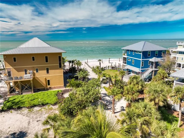 Aerial view with a water view and a beach view