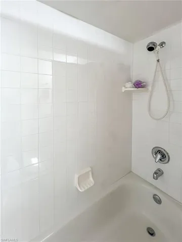 Full bathroom with shower / bath combination