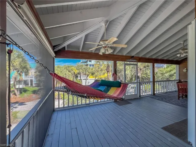 Wooden terrace featuring ceiling fan