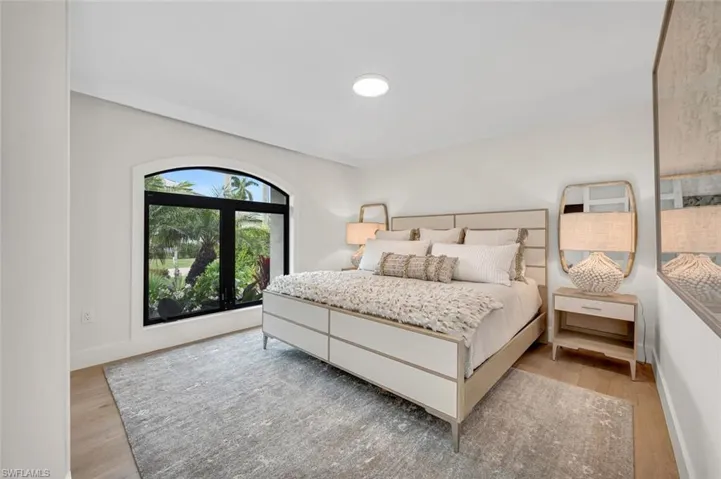 Bedroom with baseboards and light wood-style floors