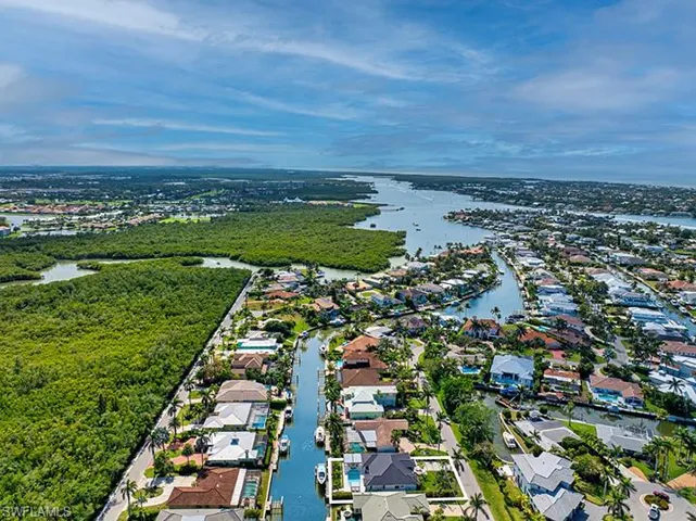 Drone / aerial view featuring a water view and a residential view
