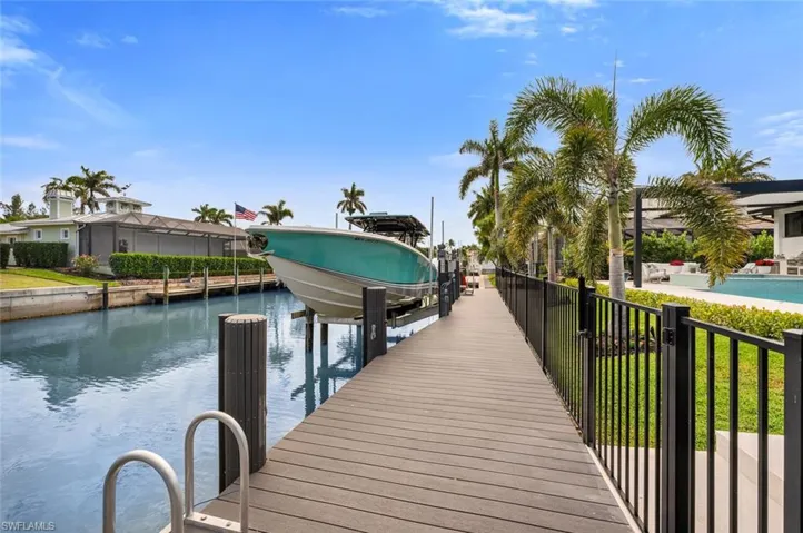 Dock area featuring a water view and boat lift