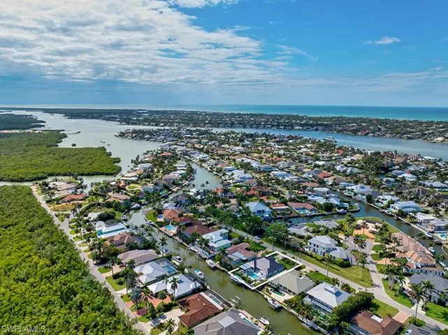 Aerial view featuring a water view and a residential view