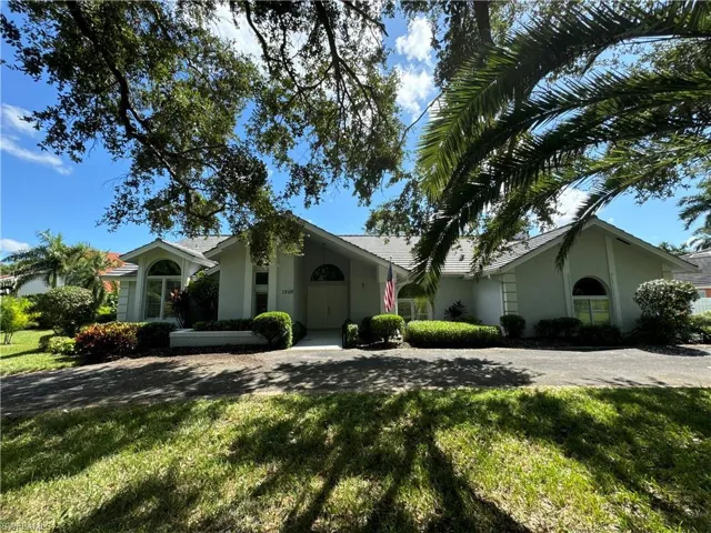 Ranch-style home with a front lawn