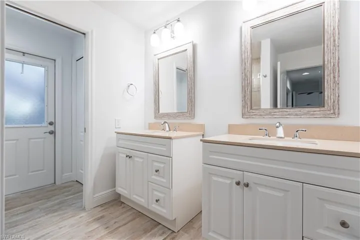 Bathroom with vanity and hardwood / wood-style flooring