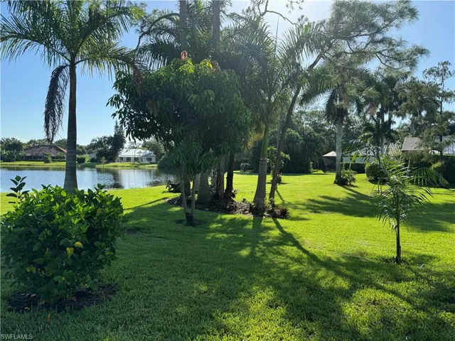 View of yard with a water view