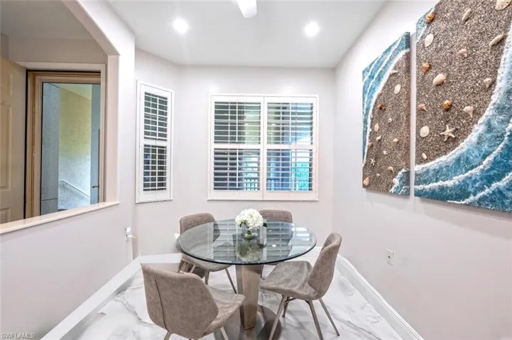 Dining room featuring recessed lighting, marble finish floor, and baseboards