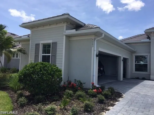 View of property exterior featuring a garage