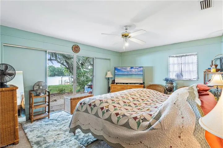 Bedroom featuring visible vents and a ceiling fan