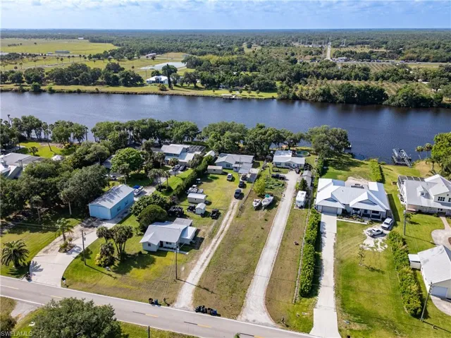 Aerial view featuring a water view and a residential view