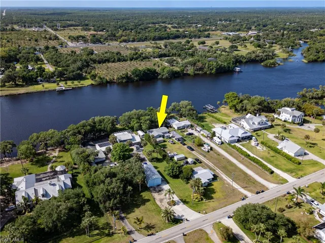 Drone / aerial view with a water view and a residential view