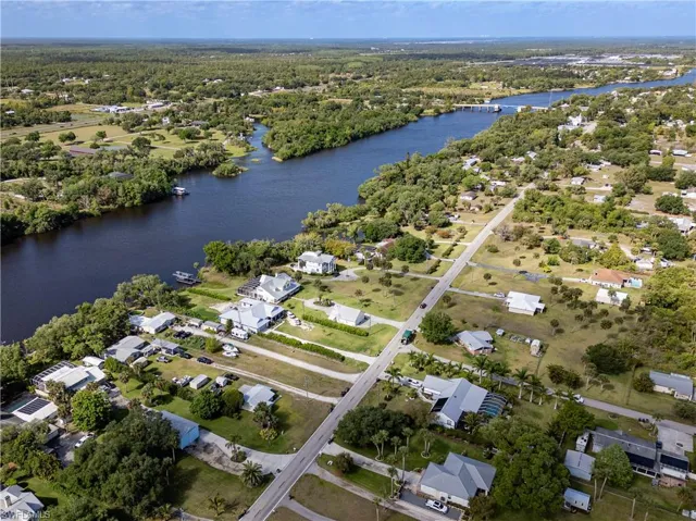 Aerial view with a water view and a residential view