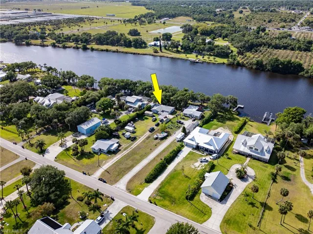 Drone / aerial view featuring a water view and a residential view