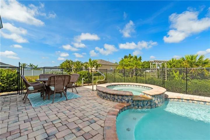 Beautiful Paver deck surrounds the pool/spa area.