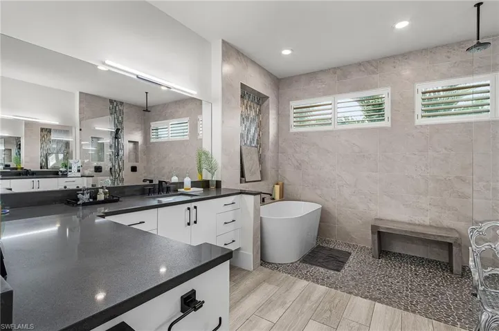 His and Her Vanities on opposite sides of bathroom