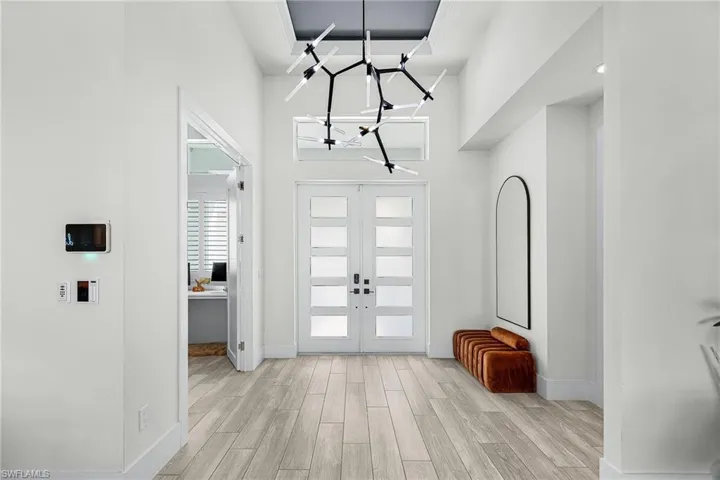 Beautiful Light Fixture and lots of Sunlight greet you as you enter the home