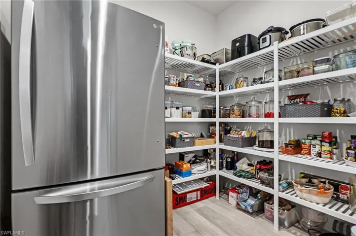 Large, Hidden Butler's Pantry with an extra refrigerator