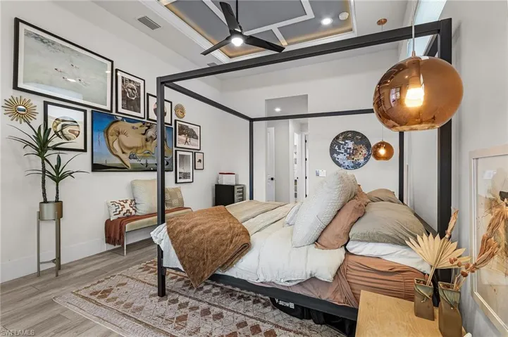 Featuring Custom-Hung Globe Pendant Lights on either side of the king-size bed and His and Her Custom-Made California Closets