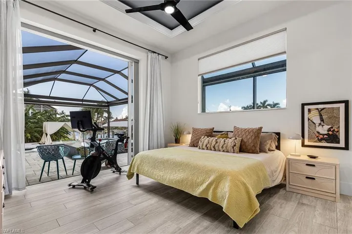 Second Primary Suite with private access to pool area set on opposite side of the house from the main primary suite.