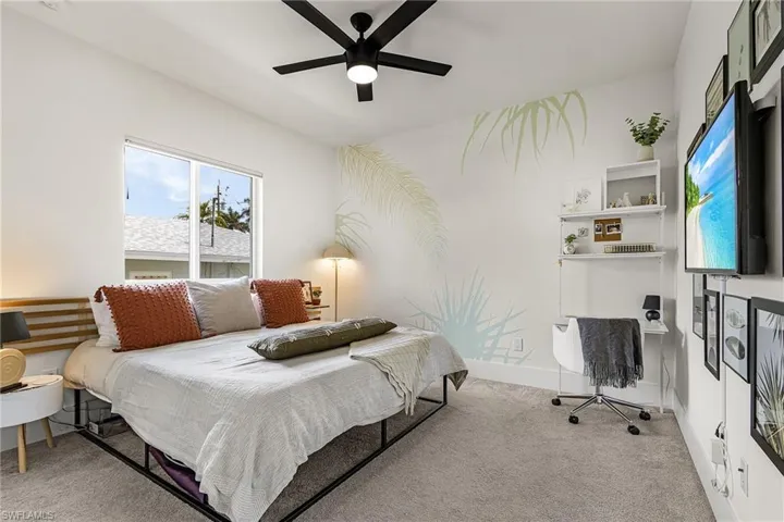 Fourth Bedroom featuring carpeting and matte black ceiling fan