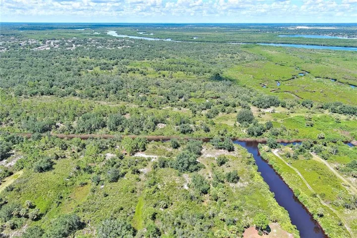 View of property location with a large body of water