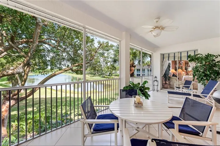 Screened covered lanai with water view on end unit