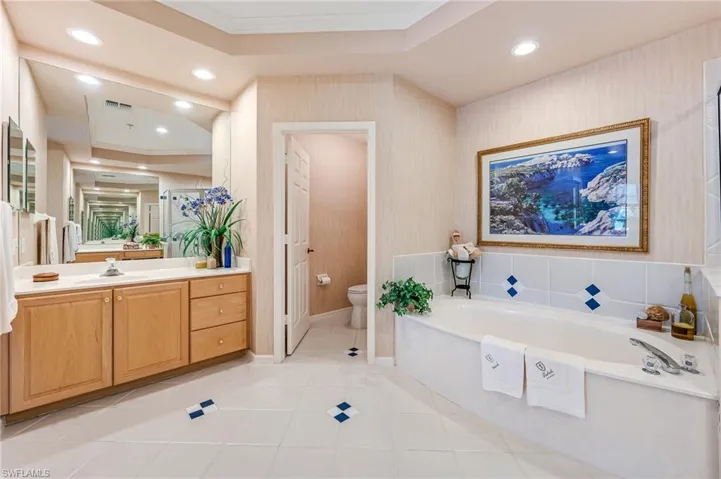 Master Bath with vanity on each side of tub and shower