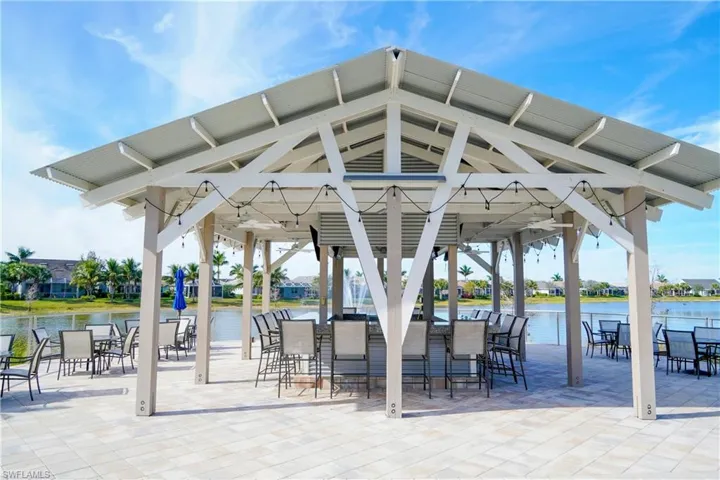 View of patio with a gazebo and a water view