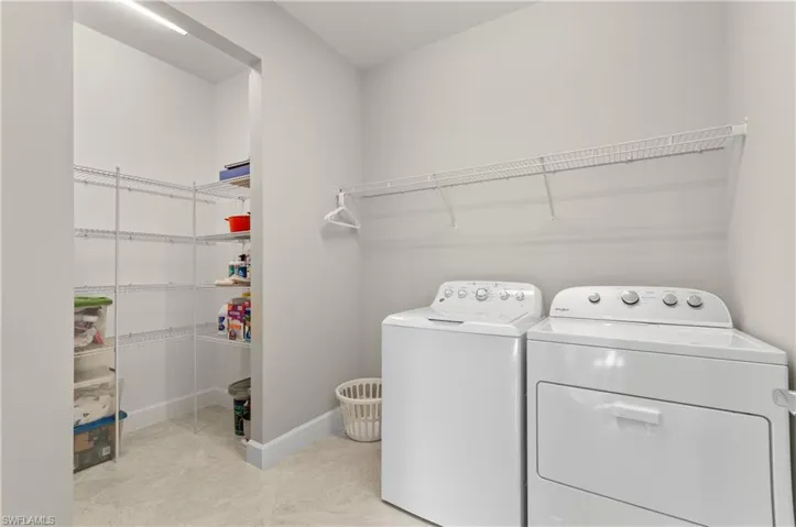 Clothes washing area with washer and clothes dryer