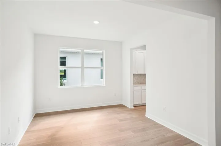 Unfurnished room featuring light wood-type flooring