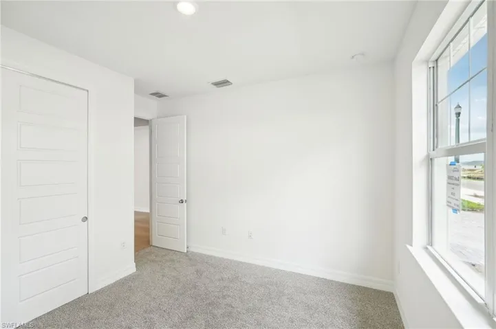 Unfurnished bedroom featuring carpet