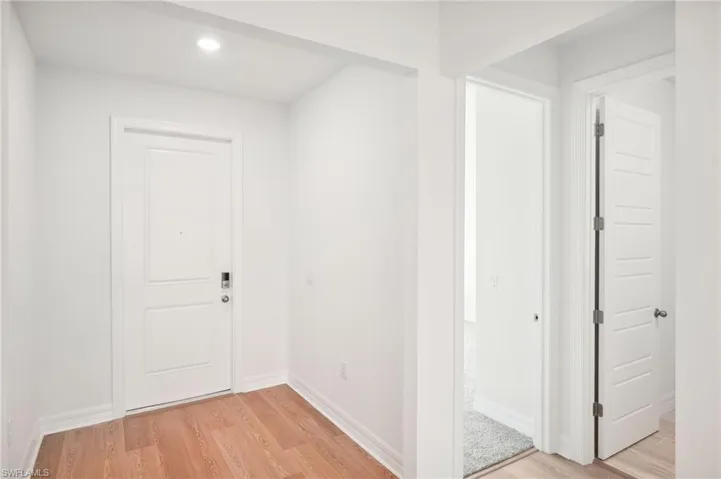 Hallway featuring light hardwood / wood-style flooring