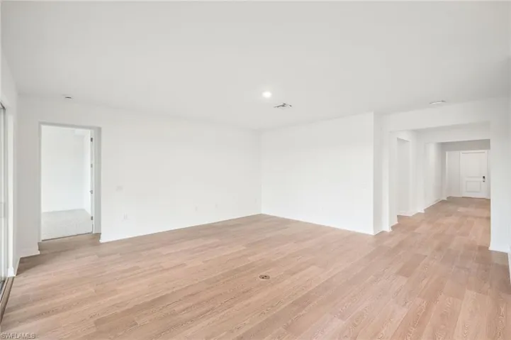 Unfurnished room with light wood-type flooring